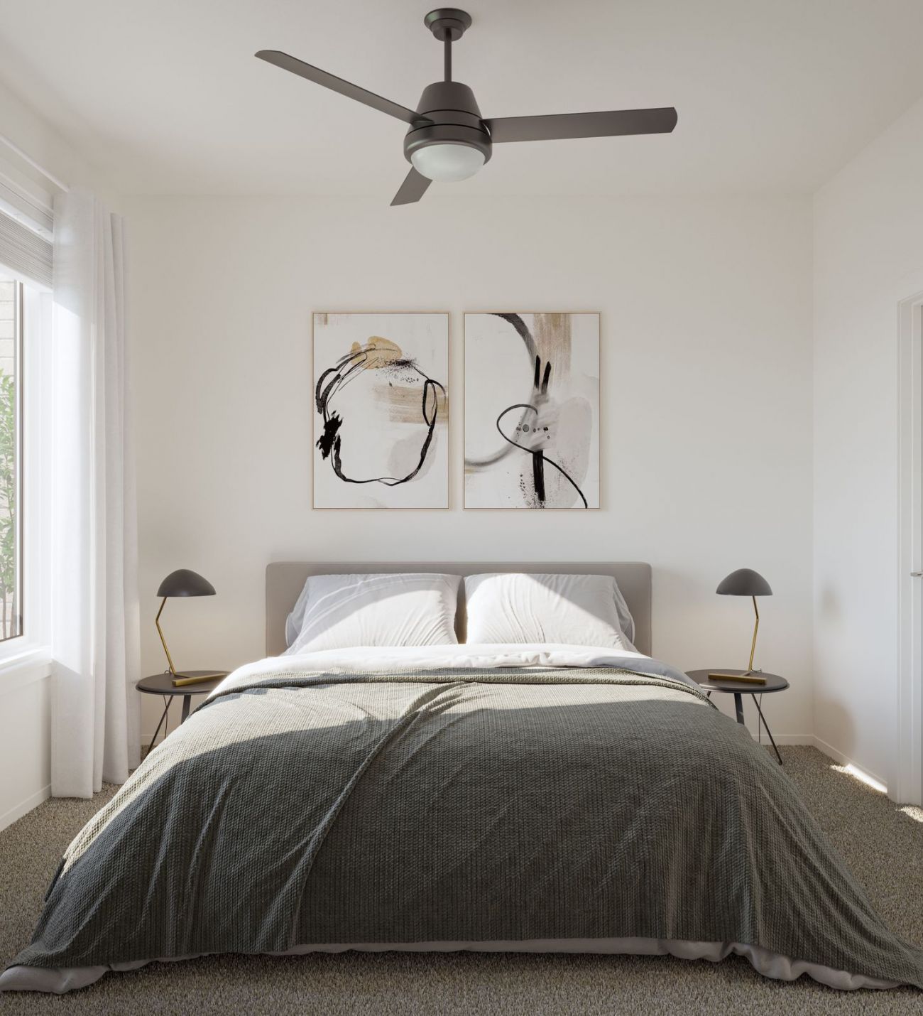 The Oslo A cozy bedroom featuring a bed, a ceiling fan, and a window allowing natural light to enter the space.